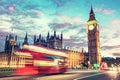 Red bus on Westminster bridge next to Big Ben in London, the UK at night Royalty Free Stock Photo