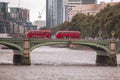 Red buses on Big Bens bridge in London, UK