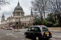 Red busses and cars in front of Saint Pauls Cathedral in London Royalty Free Stock Photo