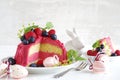 Red buttercream cake with blueberries and raspberriesto easter Royalty Free Stock Photo