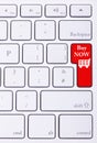 Red button on keyboard with buy now words on it Royalty Free Stock Photo