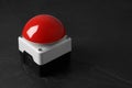 Red button of nuclear weapon on black background, closeup with space for text. War concept Royalty Free Stock Photo