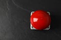 Red button of nuclear weapon on black background, top view with space for text. War concept Royalty Free Stock Photo