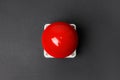 Red button of nuclear weapon on grey background, top view. War concept