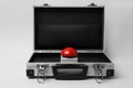 Red button of nuclear weapon in suitcase on white background. War concept