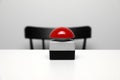 Red button of nuclear weapon on white table. War concept