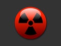 Red button with symbol of radioactivity and radioactive radiation Royalty Free Stock Photo