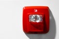 Red button warning light flasher fire alarm on the wall Royalty Free Stock Photo