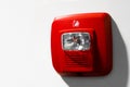 Red button warning light flasher fire alarm on the wall Royalty Free Stock Photo