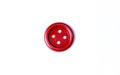 Red button on a white background close-up. Beautiful bright isolate button for cutting out. Copy space. Top view. Flat lay. Decor Royalty Free Stock Photo