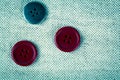 Red buttons on the old clothes Royalty Free Stock Photo