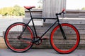 Red bycicle parked near bench in park Royalty Free Stock Photo