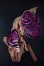 Red cabbage cut in half with napkin and kitchen knife Royalty Free Stock Photo