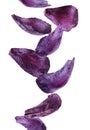 Red cabbage leaves falling on background Royalty Free Stock Photo