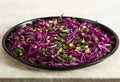 Red cabbage salad with fresh green onions dill and sprouted mung beans on a white background. Vegetarian dish. Top view. Concept o Royalty Free Stock Photo