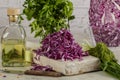 Red cabbage salad with fresh green onions dill and sprouted mung beans on a white background. Vegetarian dish. Top view. Concept o Royalty Free Stock Photo