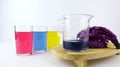 Red cabbage and three glasses filled with colored liquid. Make a measure of the pH (power of hydrogen) of red cabbage.
