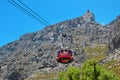 Red cabin cable car that rotates around, Table Mountain National Park on a beautiful sunny day.