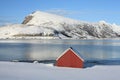 Red cabin on icy fjord Royalty Free Stock Photo