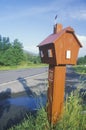 A red cabin mailbox