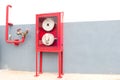 Red Cabinets for fire extinguishers Stick to the gray wall Royalty Free Stock Photo