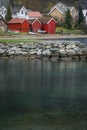 3 red cabins in Norway on water and fjord in Aurland