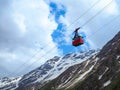 Red cable car in the background of the mountains Old red cable car at mountain. Royalty Free Stock Photo