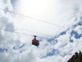 Red cable car in the background of the mountains Old red cable car at mountain. Royalty Free Stock Photo