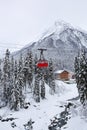 Red cable car on a background of snow mountains Royalty Free Stock Photo