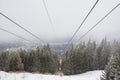 Red cable car descend from mountain peak Royalty Free Stock Photo