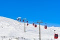 Red cable car in a ski resort in the Alps. Red gondola funicular in a ski resort, sweden, frosty sunny day Royalty Free Stock Photo