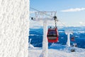 Red cable car in a ski resort in the Alps. Red gondola funicular in a ski resort, sweden, frosty sunny day Royalty Free Stock Photo