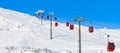 Red cable car in a ski resort in the Alps. Red gondola funicular in a ski resort, sweden, frosty sunny day Royalty Free Stock Photo