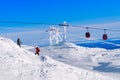 Red cable car in a ski resort in the Alps. Red gondola funicular in a ski resort, sweden, frosty sunny day Royalty Free Stock Photo