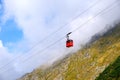 Red cable car over the mountains Royalty Free Stock Photo