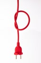 Red cable ready to switch on to electricity isolated. Electric plug, power plug Royalty Free Stock Photo