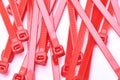 Red cable ties. Commercial photo on white background.