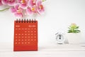 The Red calendar November 2023. Desk calendar for year 2023 and pink color orchid