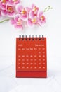 The Red calendar September 2023. Desk calendar for year 2023 and pink color orchid