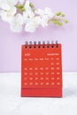 The Red calendar September 2023. Desk calendar for year 2023 and white orchid