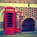 Red call-box on a background a brick wall Royalty Free Stock Photo