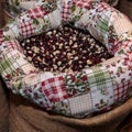 Red Calypso Beans inside Jute Sack for Sale at Market Royalty Free Stock Photo