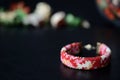 Red camouflage seed beads bracelet on a dark background Royalty Free Stock Photo