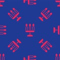 Red Candelabrum with three candlesticks icon isolated seamless pattern on blue background. Vector Royalty Free Stock Photo
