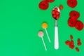 red candies and lollipops on a plain blue background. wallpaper to use text. graphic resource Royalty Free Stock Photo