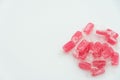 Red candies in transparent wrapper on white background close up top view with copy space Royalty Free Stock Photo