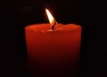 Red candle blowing with darkness everywhere Royalty Free Stock Photo