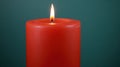 Red candle burning, dark background, studio shot, peaceful mood Royalty Free Stock Photo