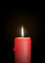 Red Candle Burning in the Dark. Surface is Decorated with Starlet Texture!