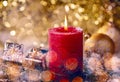 Red candle with christmas decoration